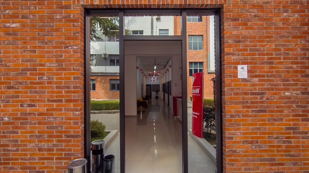 The brick entrance of the Canadian Institute of Technology, looking through to the corridor